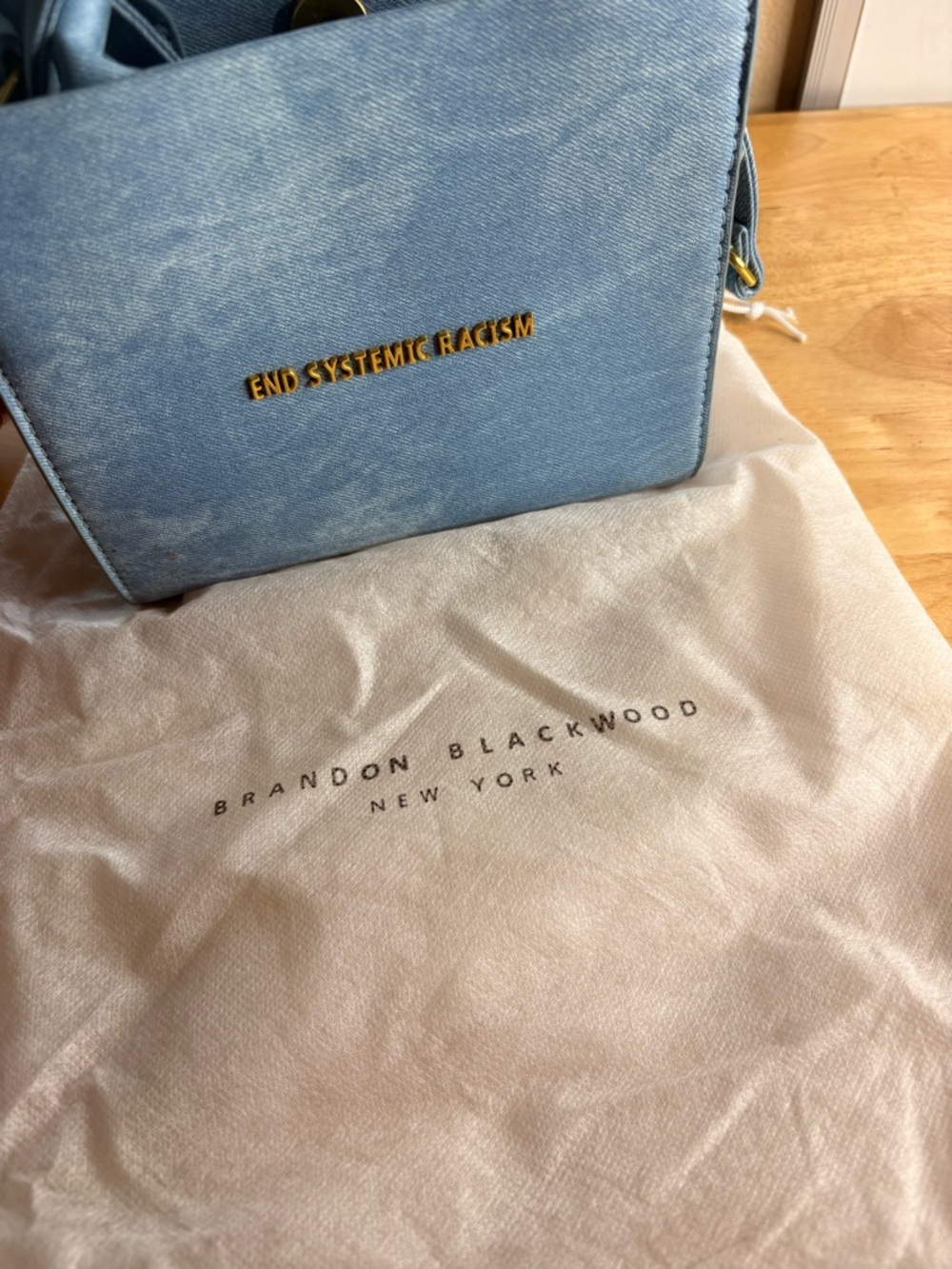 Brandon Blackwood Blue Crossbody Bag – "End Systemic Racism" Accent